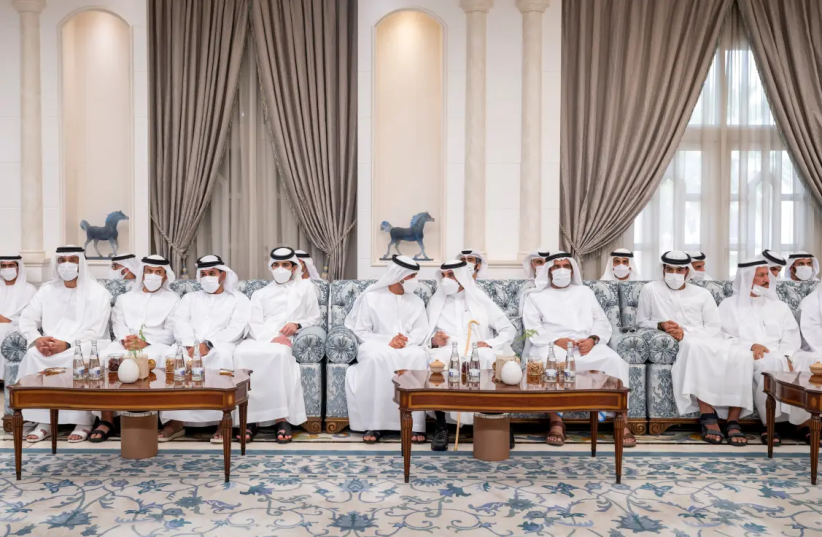  Members of the Royal family sit while receiving condolences after the death of late President of the United Arab Emirates Sheikh Khalifa bin Zayed Al Nahyan at Mushrif Palace in Abu Dhabi, United Arab Emirates, May 15, 2022.  (photo credit: REUTERS, United Arab Emirates Ministry of Presidential Affairs/Handout via REUTERS )