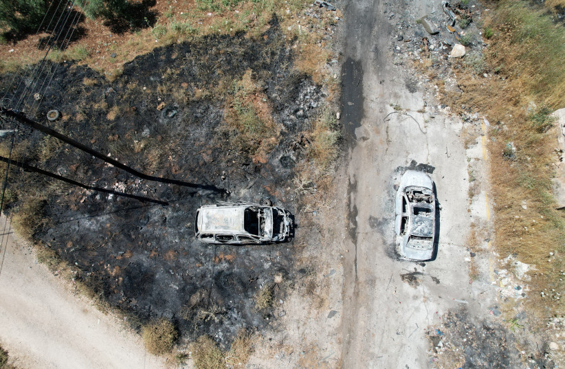  An aerial view shows burned vehicles after an attack by Israeli settlers near Ramallah in the West Bank, June 21, 2023. (photo credit: AMMAR AWAD/REUTERS)