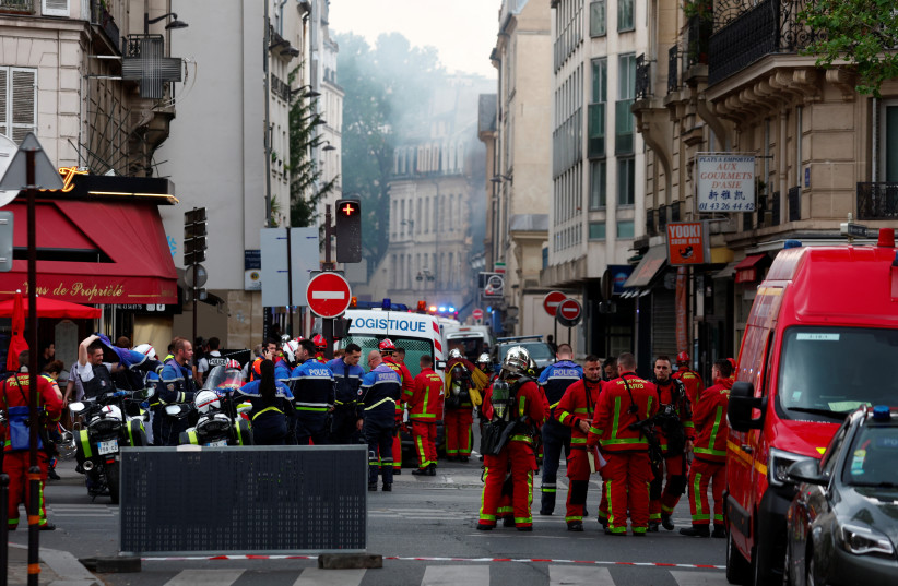  French firefighters and rescue forces work after several buildings on fire following a gas explosion in the fifth arrondissement of Paris, France, June 21, 2023 (photo credit: Gonzalo Fuentes/Reuters)