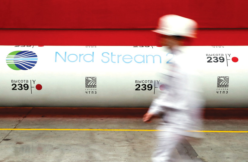  THE LOGO of the Nord Stream 2 gas pipeline project is displayed on a pipe at the Chelyabinsk pipe rolling plant in Russia. Russian gas exports to Europe are in free fall, say the writers. (photo credit: REUTERS/MAXIM SHEMETOV)