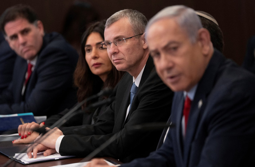  Prime Minister Benjamin Netanyahu and Justice Miniser Yariv Levin attend a weekly cabinet meeting in the prime minister's office in Jerusalem, June 18, 2023 (photo credit: Ohad Zwigenberg/Pool via REUTERS)
