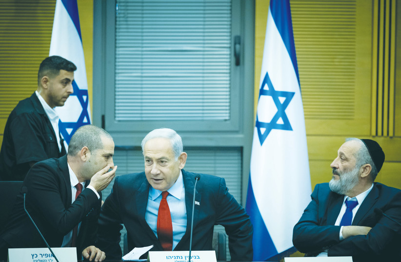  ISRAELI PRIME MINISTER Benjamin Netanyahu meets with coalition leader MK Ophir Katz and Shas’s Arye Deri in the Knesset.  (photo credit: YONATAN SINDEL/FLASH90)