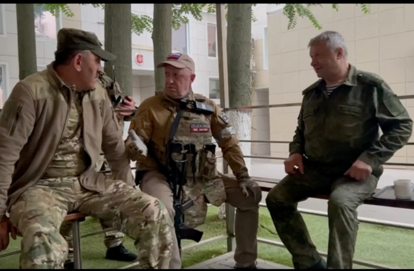  Founder of Wagner private mercenary group Yevgeny Prigozhin speaks with Russia's Deputy Minister of Defense Yunus-Bek Yevkurov, at the headquarters of the Southern Military District of the Russian Armed Forces in Rostov-on-Don, Russia, in this screen grab from a video released on June 24, 2023. (photo credit: VIA REUTERS)