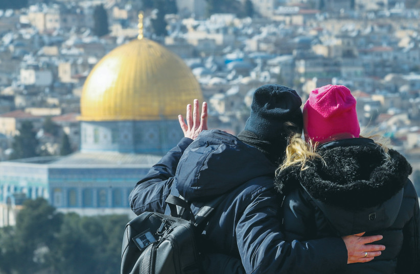 TOURISTS STAND on the Mount of Olives, overlooking Jerusalem’s Old City. Talking about Israel isn’t enough; American Zionist families must visit Israel, says the writer. (photo credit: JAMAL AWAD/FLASH90)