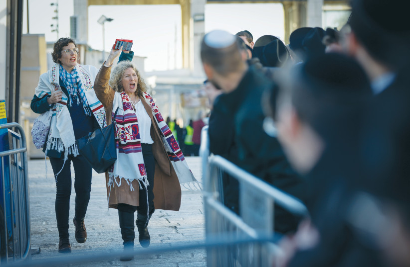  MEMBERS OF Women of the Wall arrive for Rosh Hodesh prayers at the Western Wall, earlier this year. (photo credit: ERIK MARMOR/FLASH90)