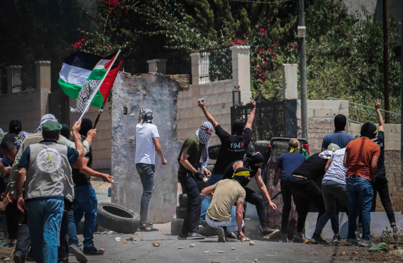  Palestinian demonstrators clash with Israeli security forces during a protest in the village of Kfar Qaddum, in the West Bank, June 23, 2023 (photo credit: NASSER ISHTAYEH/FLASH90)