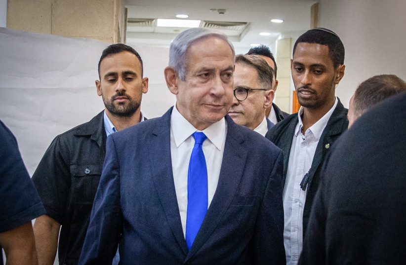  Prime Minister Benjamin Netanyahu arrives at the District Court in Jerusalem to listen to the testimony of businessman Arnon Milchan's first day of testimony for Netanyahu's Case 1000 corruption trial on June 25, 2023.   (photo credit: OREN BEN HAKOON/FLASH90)