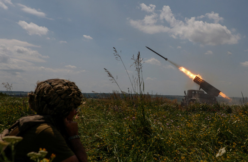  Ukrainian servicemen of the 47th Magura Separate Mechanised Brigade fire a BM-21 Grad multiple launch rocket system towards Russian troops near a front line, amid Russia's attack on Ukraine, in Zaporizhzhia region, Ukraine June 25, 2023. (photo credit: RADIO FREE EUROPE/RADIO LIBERTY/SERHII NUZHNENKO VIA REUTERS)