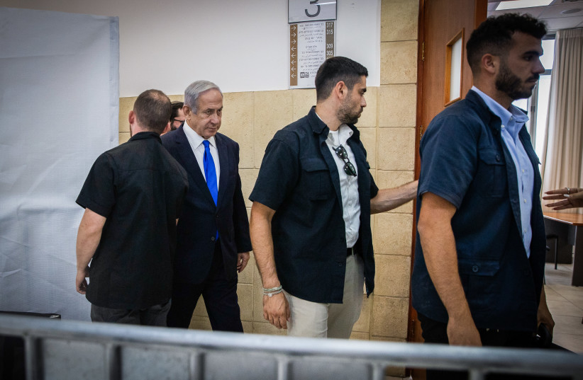  Prime Minister Benjamin Netanyahu seen at the District Court in Jerusalem to as he arrives to listen to the testimony of businessman Arnon Milchan's on the first day of his testimony for Netanyahu's Case 1000 corruption trial on June 25, 2023. (photo credit: OREN BEN HAKOON/FLASH90)
