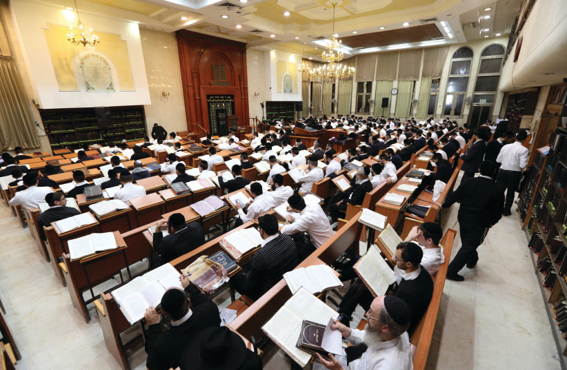  MEN STUDY the Talmud and other holy books at a Beit Midrash.  (photo credit: YAAKOV NAUMI/FLASH90)