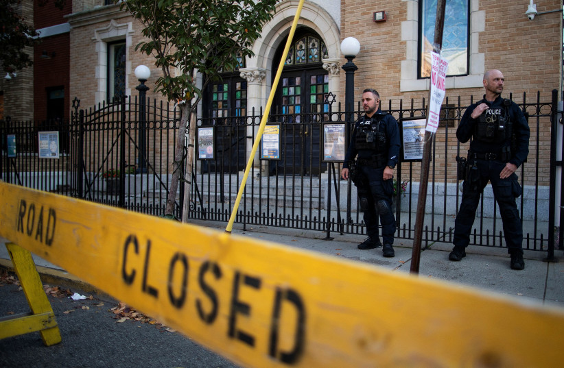  IN A scene repeated across America, police stand guard in front of the United Synagogue of Hoboken, New Jersey, 2022. (photo credit: Eduardo Munoz/Reuters)