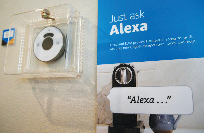  PROMPTS ON how to use the Alexa personal assistant are seen in an Amazon ‘experience center’ in California.  (photo credit: ELIJAH NOUVELAGE/REUTERS)