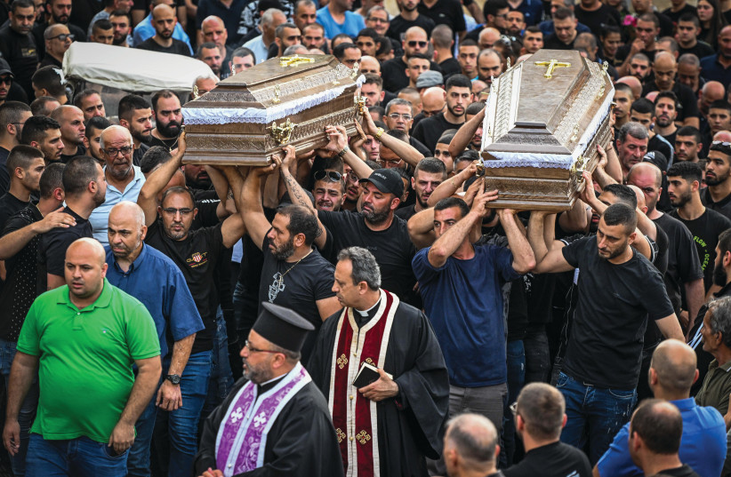  CARRYING THE coffins of two of the five men murdered the day before in Yafa an-Naseriyye, June 9.  (photo credit: FLASH90)