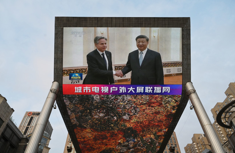 A CHINA Central Television news broadcast shows US Secretary of State Antony Blinken meeting with China’s President Xi Jinping, outside a mall in Beijing, June 19.  (photo credit: Greg Baker/AFP via Getty Images)