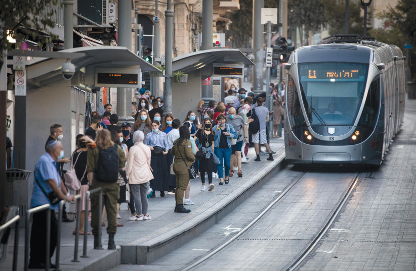  EVERY PASSENGER is a story on the Jerusalem light rail.  (photo credit: YONATAN SINDEL/FLASH90)