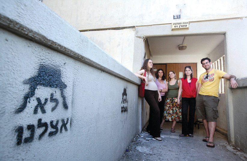  HEBREW UNIVERSITY dorm in Kiryat Yovel, with anti-haredi graffiti, 2009 – even then, tensions were rising as the neighborhood was becoming increasingly Orthodox. (photo credit: ABIR SULTAN/FLASH90)