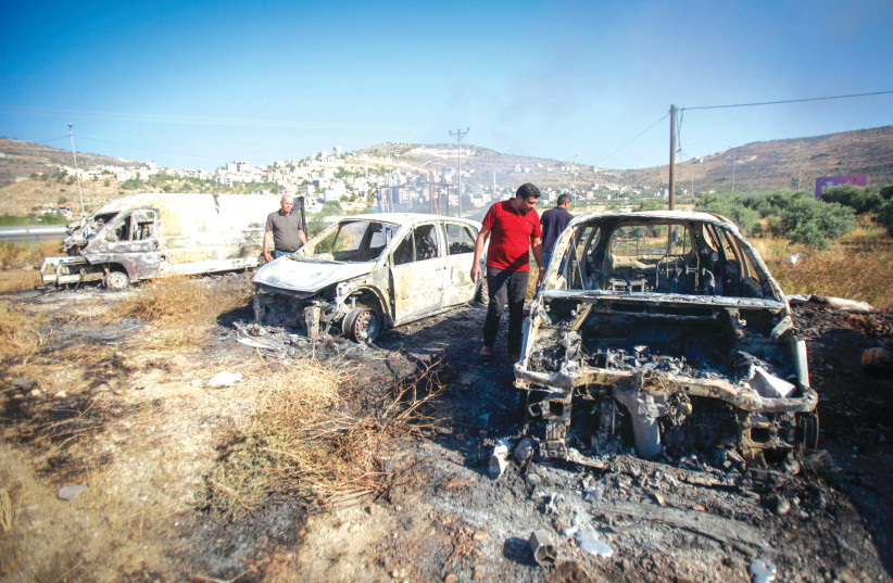  CHARRED CARS after they were set on fire by Jewish attackers in the West Bank village of Laban Sharqiya, last week. (photo credit: NASSER ISHTAYEH/FLASH90)