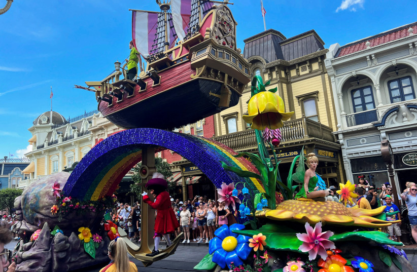  A float with people dressed as characters from the Walt Disney movie "Peter Pan" is seen as people attend the "Festival of Fantasy" parade at the Walt Disney World Magic Kingdom theme park in Orlando, Florida, U.S. July 30, 2022 (photo credit: REUTERS/OCTAVIO JONES/FILE PHOTO)