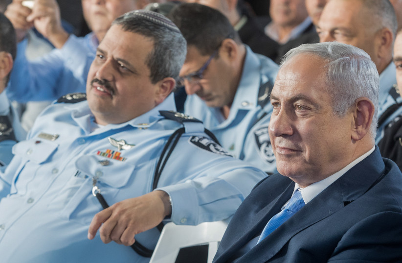  PRIME MINISTER Benjamin Netanyahu and then-police commissioner Roni Alsheich attend a ceremony marking the opening of a new police station, in 2017. (photo credit: BASEL AWIDAT/FLASH90)