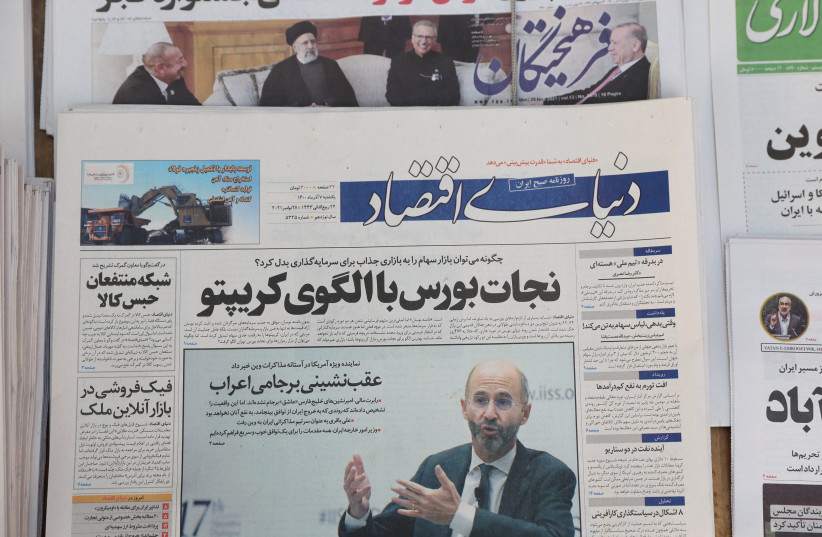   A newspaper with a cover picture of US Special Representative for Iran Robert Malley is seen in Tehran, Iran, November 29, 2021 (photo credit: MAJID ASGARIPOUR/WANA (WEST ASIA NEWS AGENCY) VIA REUTERS)