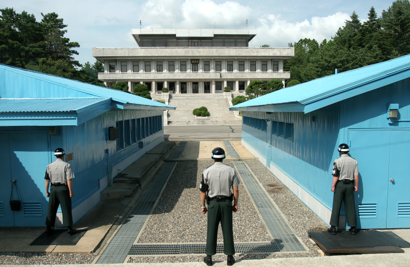  Three ROK soldiers watching the border at Panmunjeom in the DMZ between North and South Korea, 2008 (photo credit: Wikimedia Commons)