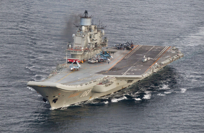 A photo taken from a Norwegian surveillance aircraft shows Russian aircraft carrier Admiral Kuznetsov in international waters off the coast of Northern Norway on October 17, 2016. (photo credit: 333 Squadron, Norwegian Royal Airforce/NTB Scanpix/Handout via Reuters)