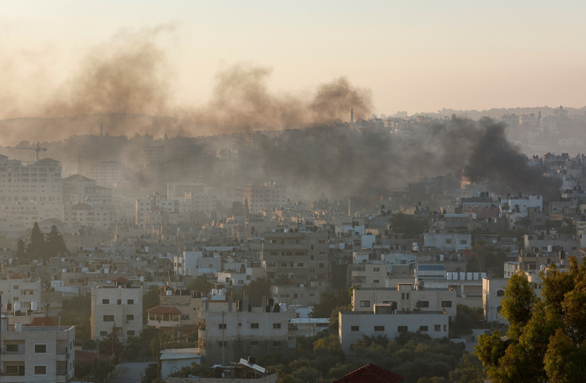  Smoke rises amid an Israeli military operation, in Jenin, in the West Bank July 4, 2023. (photo credit: MOHAMAD TOROKMAN/REUTERS)