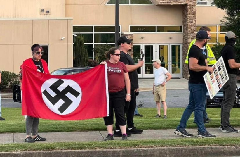  Neo-Nazis wave swastika flags outside of Georgia synagogue this past June  (photo credit: Jenifer Caron Derrick, Facebook)