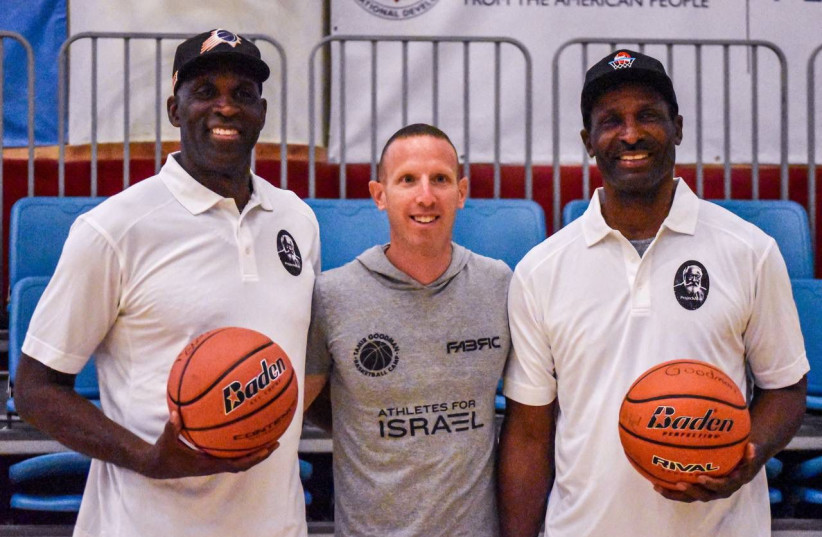  POSING AT the Jerusalem YMCA are former NBA stars Mark West (left) and Eddie Johnson (right) flanking Israel’s Tamir Goodman. (photo credit: YEHUDA HALICKMAN)