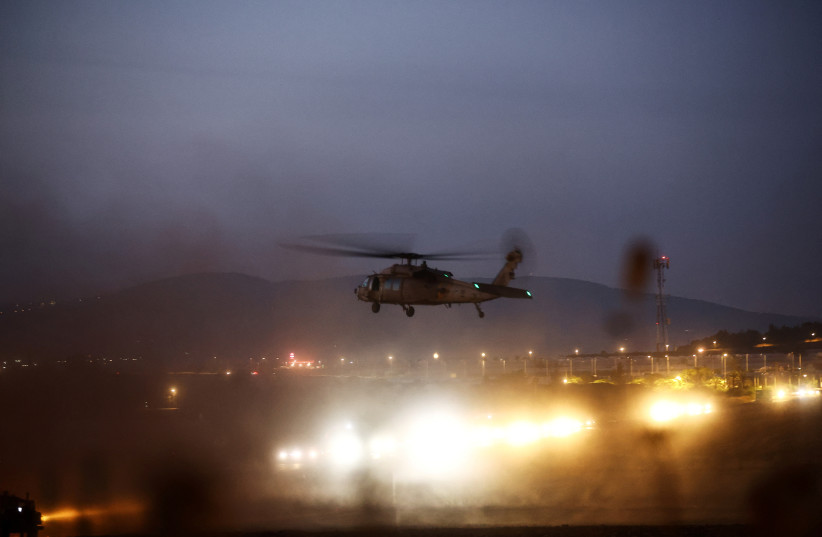  An Israeli military helicopter takes off as it carries a wounded soldier just outside Jalamah checkpoint near Jenin refugee camp in the West Bank (photo credit: REUTERS)
