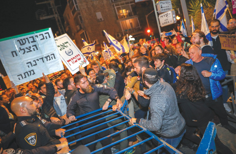  PLACARDS AT a protest against the judicial overhaul include one which reads: ‘The occupation has succeeded, the state has died,’ near the prime minister’s home in Jerusalem, earlier this year (photo credit: NOAM REVKIN FENTON/FLASH90)