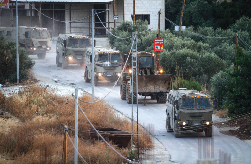  ISRAELI ARMY vehicles drive through Jenin, on Tuesday. There is no military solution to the Israeli-Palestinian conflict, says the writer (photo credit: NASSER ISHTAYEH/FLASH90)