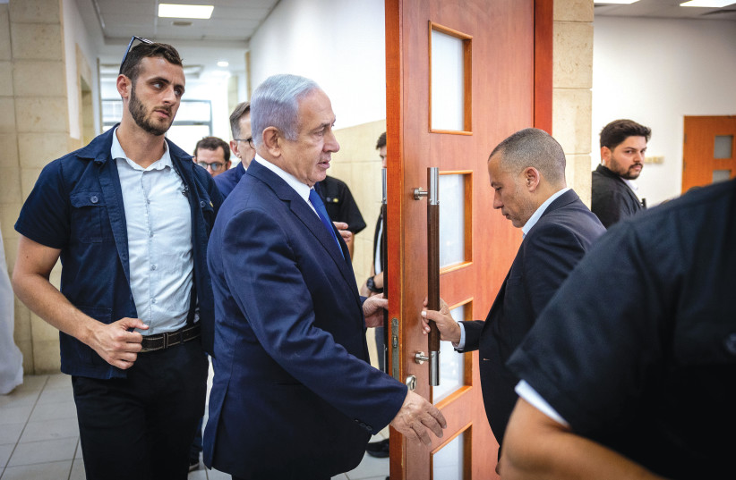  PRIME MINISTER Benjamin Netanyahu at the Jerusalem District Court last week: A jury system would reduce the amount of time the prime minister’s or any other political figure’s life is disrupted, says the writer (photo credit: YONATAN SINDEL/FLASH90)