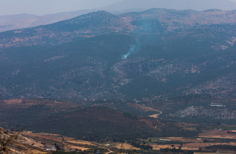  Smoke rises in Kfarshouba, as seen from the village of Khiam, near the border with Israel, in southern Lebanon, July 6, 2023.  (photo credit: AZIZ TAHER/REUTERS)