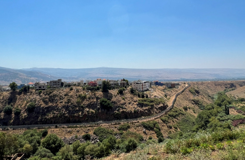  A general view shows the disputed village of Ghajar, as seen from the Lebanese village of Wazzani near the border with Israel, in southern Lebanon, July 6, 2023. (photo credit: AZIZ TAHER/REUTERS)