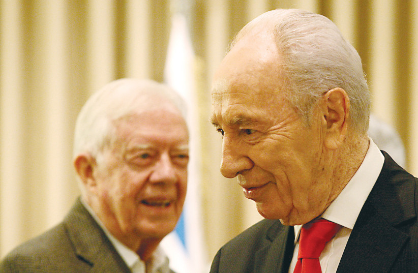  THEN-PRESIDENT Shimon Peres meets with former US president Jimmy Carter, in Jerusalem, in 2009. Successive president have tried to duplicate Carter's achievement, but only a few come close to matching the scope of his breakthrough, says the writer.  (photo credit: ABIR SULTAN/FLASH90)