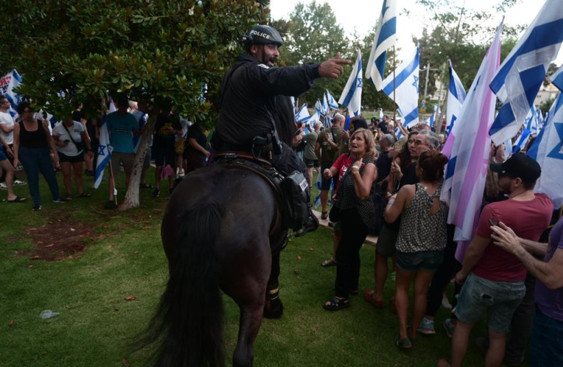  Protesters demonstrate outside the home of Knesset Speaker Amir Ohana. July 7, 2023 (photo credit: AVSHALOM SASSONI/MAARIV)