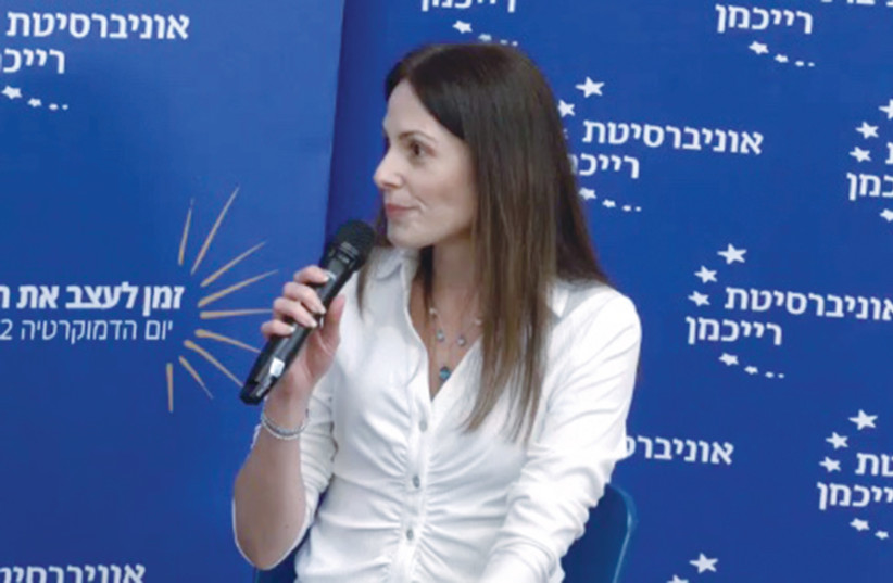  THE WRITER speaks at a Democracy Day event at Reichman University, last year. Artificial intelligence increases the possibility of false medical information and conspiracy theories being developed and distributed, she cautions.  (photo credit: Courtesy, Erga Atad)