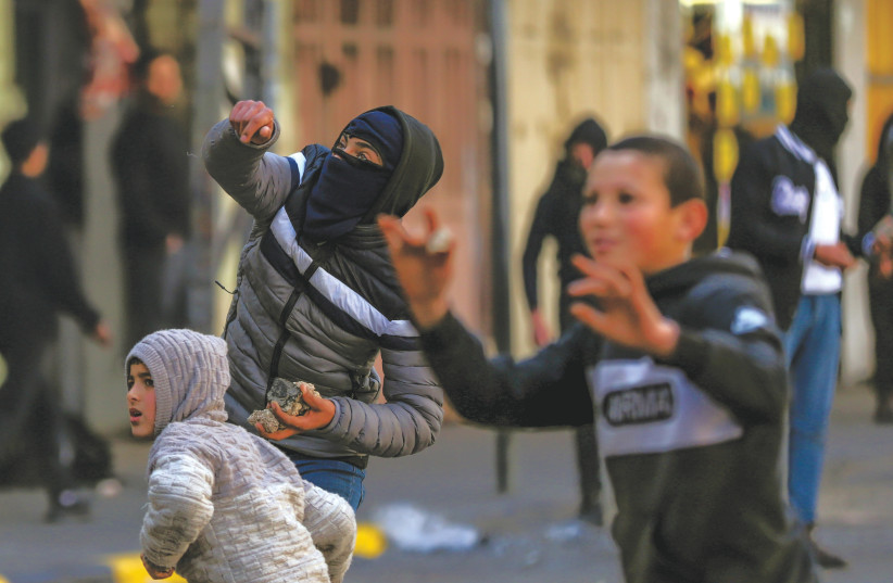  Palestinian children are among those involved in clashes with IDF soldiers in Jenin, earlier this year. (photo credit: WISAM HASHLAMOUN/FLASH90)