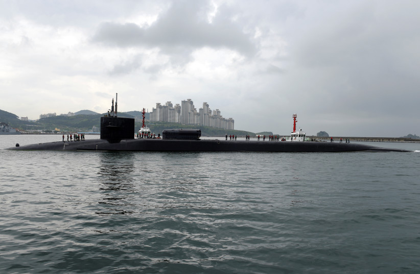 The Ohio-class guided-missile submarine USS Michigan arrives for a regularly scheduled port visit while conducting routine patrols throughout the Western Pacific in Busan, South Korea, April 24, 2017. (photo credit: Jermaine Ralliford/Courtesy U.S. Navy/Handout via REUTERS)