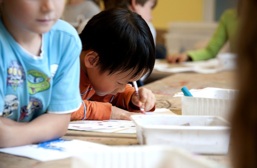  Child doing schoolwork (photo credit: Amanda Mills/USCDCP/PIXNIO)
