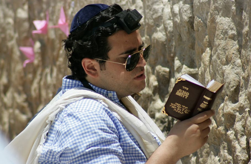  A Jew praying at the Western Wall (photo credit: WALLPAPER FLARE)