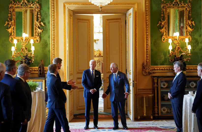  United States Special Presidential Envoy for Climate John Kerry speaks to U.S. President Joe Biden and Britain's King Charles during a climate engagement with philanthropists and investors at Windsor Castle, in Windsor, Britain, July 10, 2023.  (photo credit: REUTERS/Kevin Lamarque/POOL)
