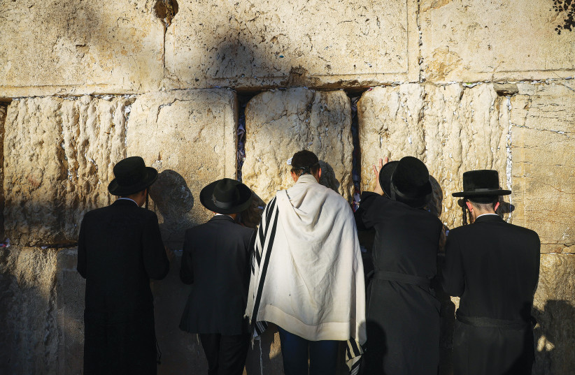  JEWS PRAY at the Western Wall on the 17th of Tamuz, last week. (photo credit: Chaim Goldberg/Flash90)