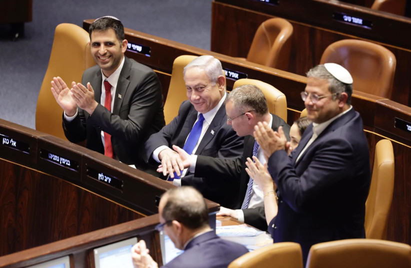  Government ministers celebrate after the Reasonableness Standard Bill passes its first reading in Knesset. (photo credit: MARC ISRAEL SELLEM)