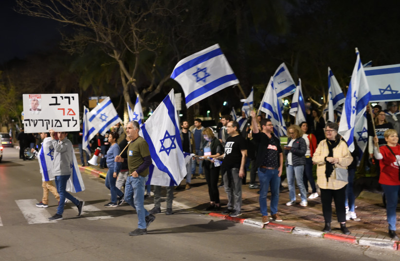  Israelis protest against Israeli government's planned judicial overhaul, outside the house of MK Danny Danon (Likud), in Raanana, March 26, 2023. (photo credit: GILI YAARI/FLASH90)