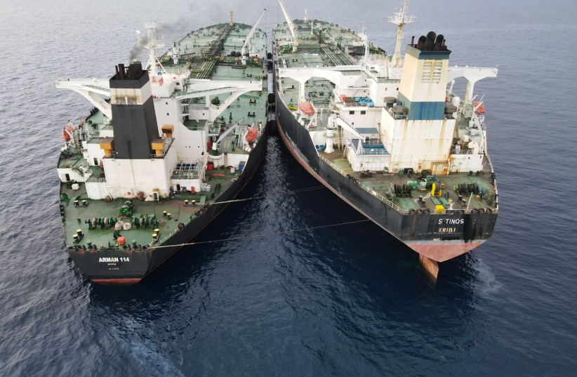  The Iranian-flagged Very Large Crude Carrier (VLCC), MT Arman 114, and the Cameroon-flagged MT S Tinos, are seen as they were spotted conducting a ship-to-ship oil transfer without a permit, according to Indonesia's Maritime Security Agency (Bakamla), near Indonesia's North Natuna Sea, Indonesia (photo credit: Indonesia's Maritime Security Agency (Bakamla) / Handout via REUTERS)