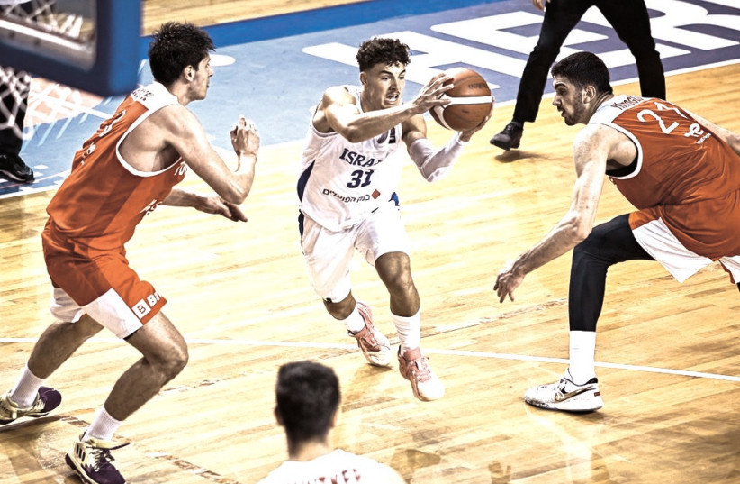  NOAM YAACOV (center) has been one of the bright spots for Israel at the Under-20 European Championships. The blue-and-white next face Spain in the round-of-16. (photo credit: FIBA/COURTESY)