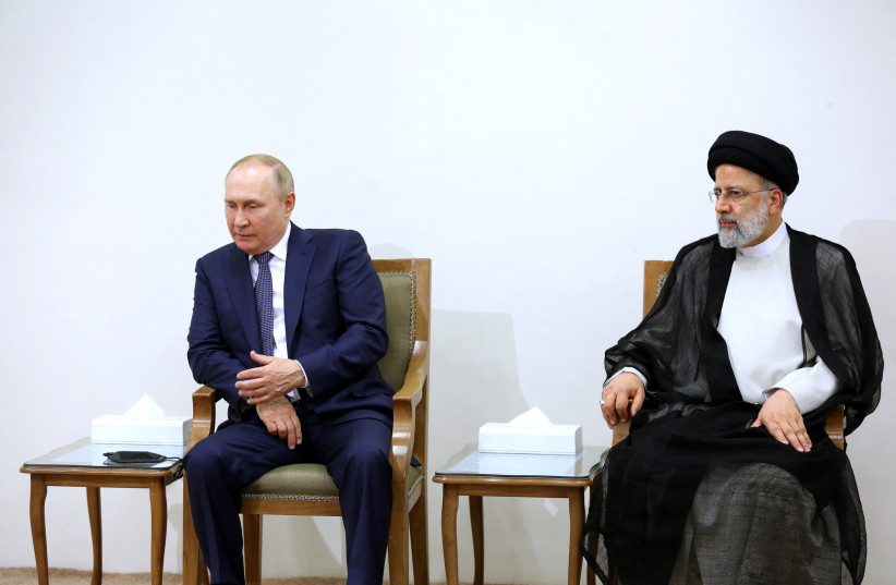  Russian President Vladimir Putin sits next to Iranian President Ebrahim Raisi during a meeting with Supreme Leader Ayatollah Ali Khamenei (not pictured) in Tehran, Iran July 19, 2022.  (photo credit: Office of the Iranian Supreme Leader/WANA/Handout via Reuters)