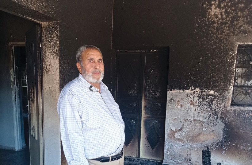  Mohammed Hejjaz stands in his burnt home in Turmus Ayya. (photo credit: LINDA GRADSTEIN)